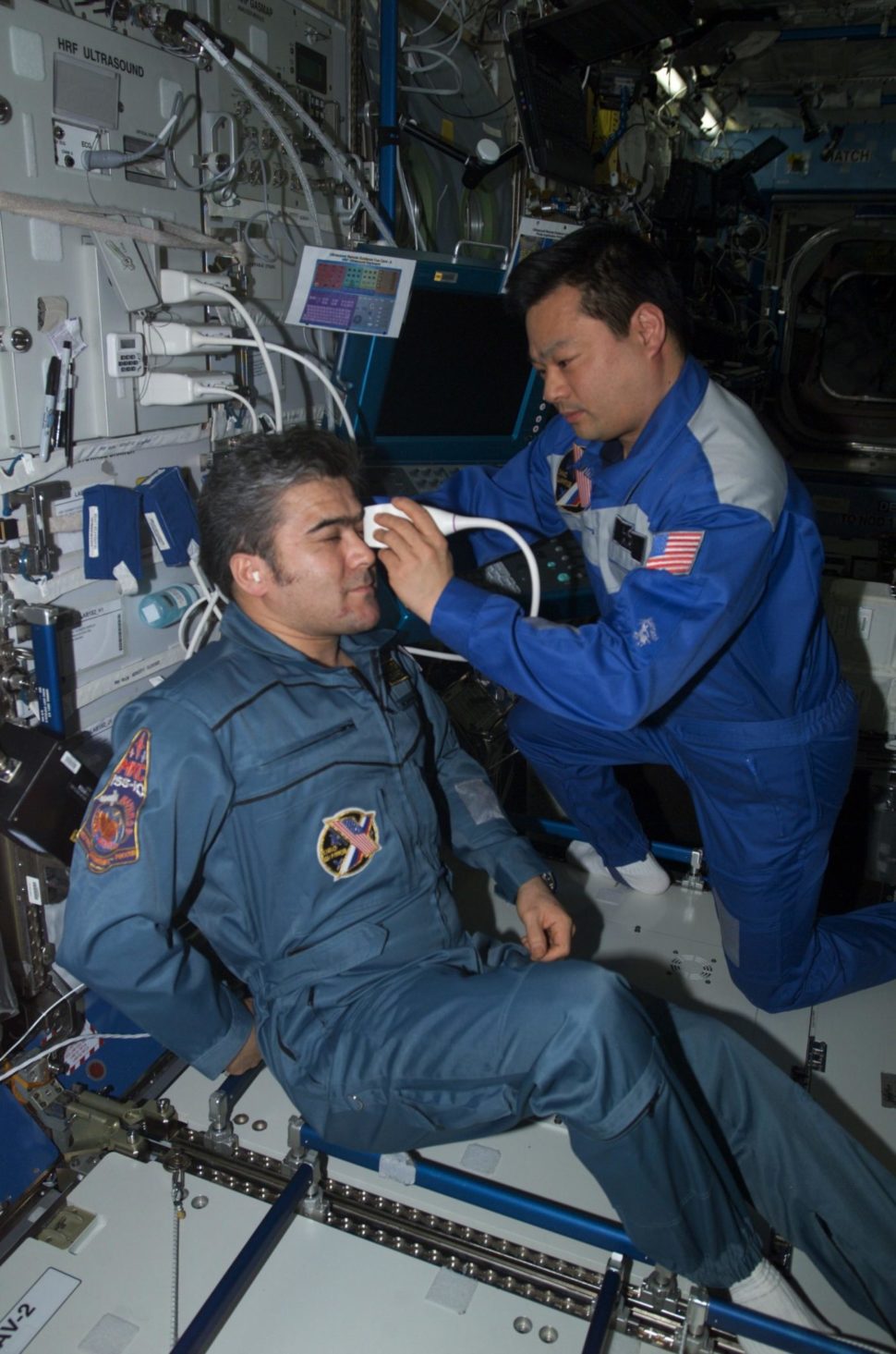 Using the ADUM protocols, ISS Expedition Commander Leroy Chiao performs an ultrasound examination of the eye on Flight Engineer Salizhan Sharipov. | NASA