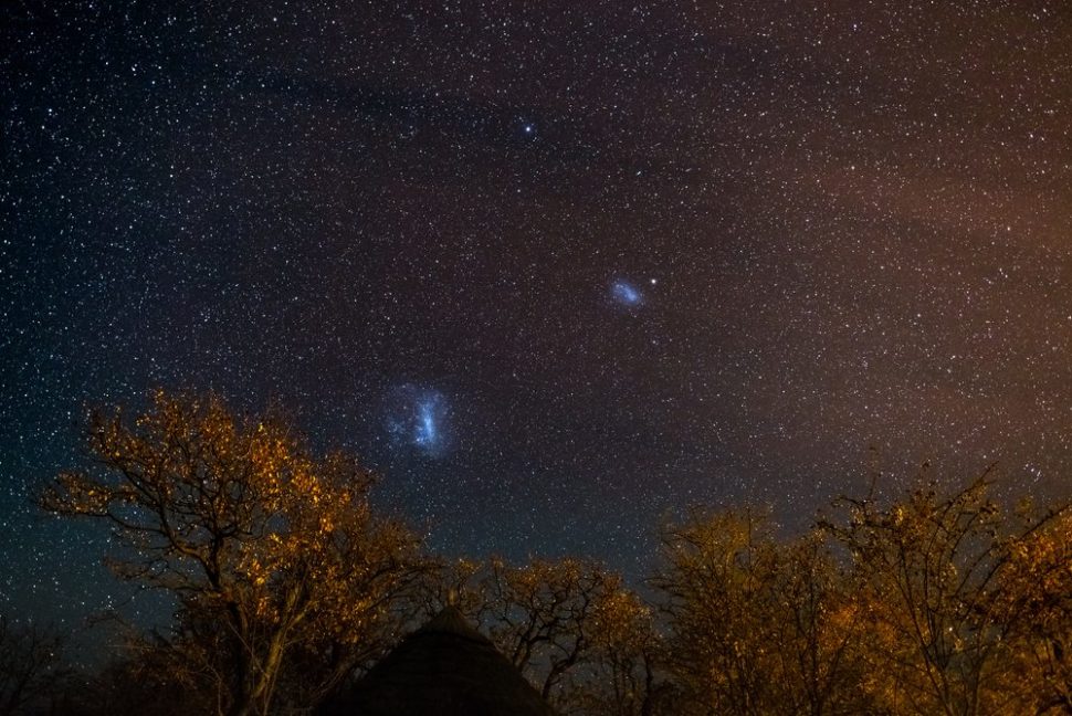 Apparently, there's another dwarf galaxy hiding in between those two smudges, the Magellanic Clouds. | Fabio Lamanna | Shutterstock.com