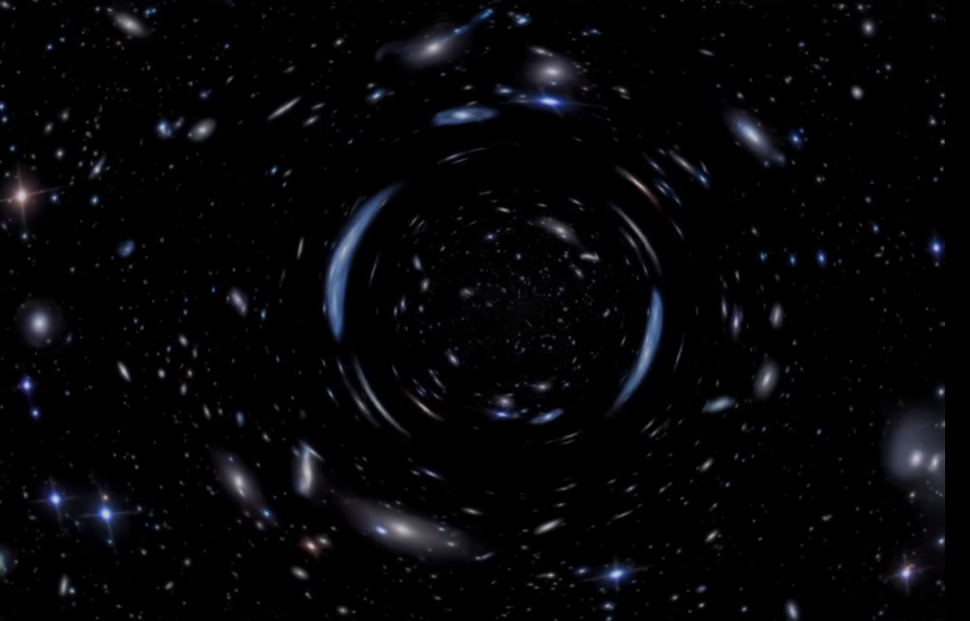 A visualization of gravitational lensing as it distorts light of background galaxies into elongated arcs and deformed shapes. | Screen grab from NASA Goddard YouTube Channel