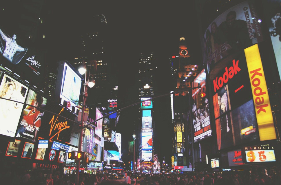 Image shows time square with advertisement from various brands